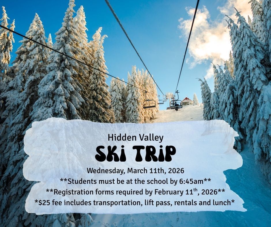 ski lift over snow covered trees and blue sky