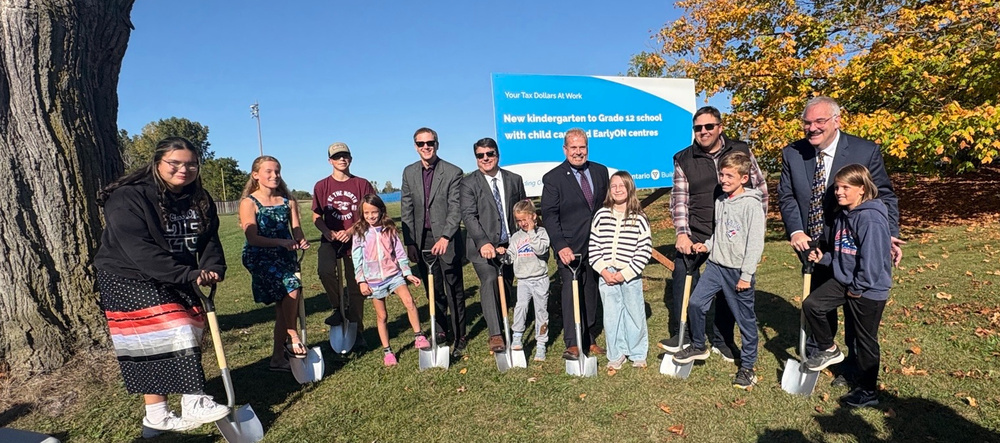 Students and leaders with shovels
