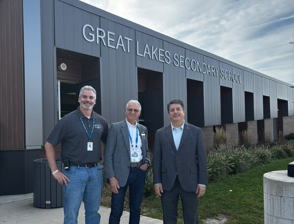 GLSS principal, police chief and ceo girardi posing in front building