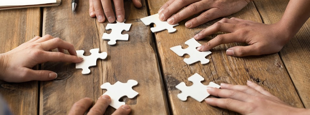group doing a puzzle