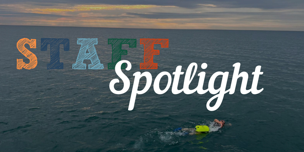 STAFF Spotlight (with swimmer in open water)