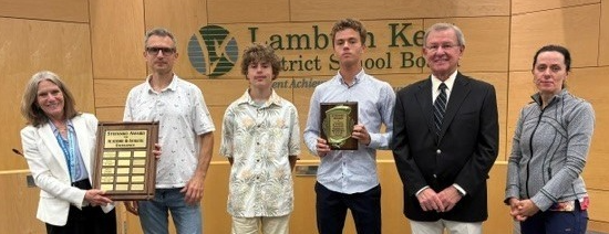 2026 Stefanko Award Winner with Stephen Stefanko + recipients familyi and principal. Posing with award.