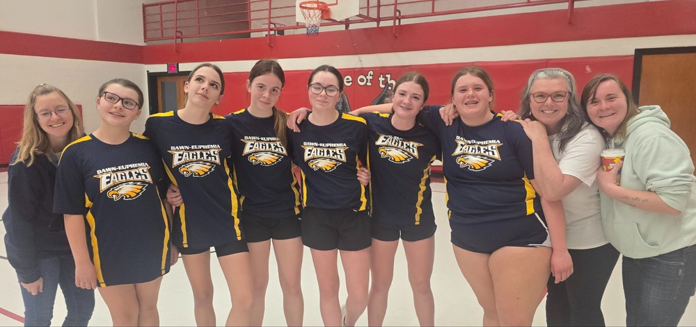 Girls basketball team with coaches