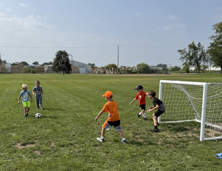 students playing soccer