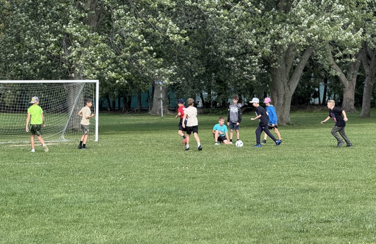 students playing soccer