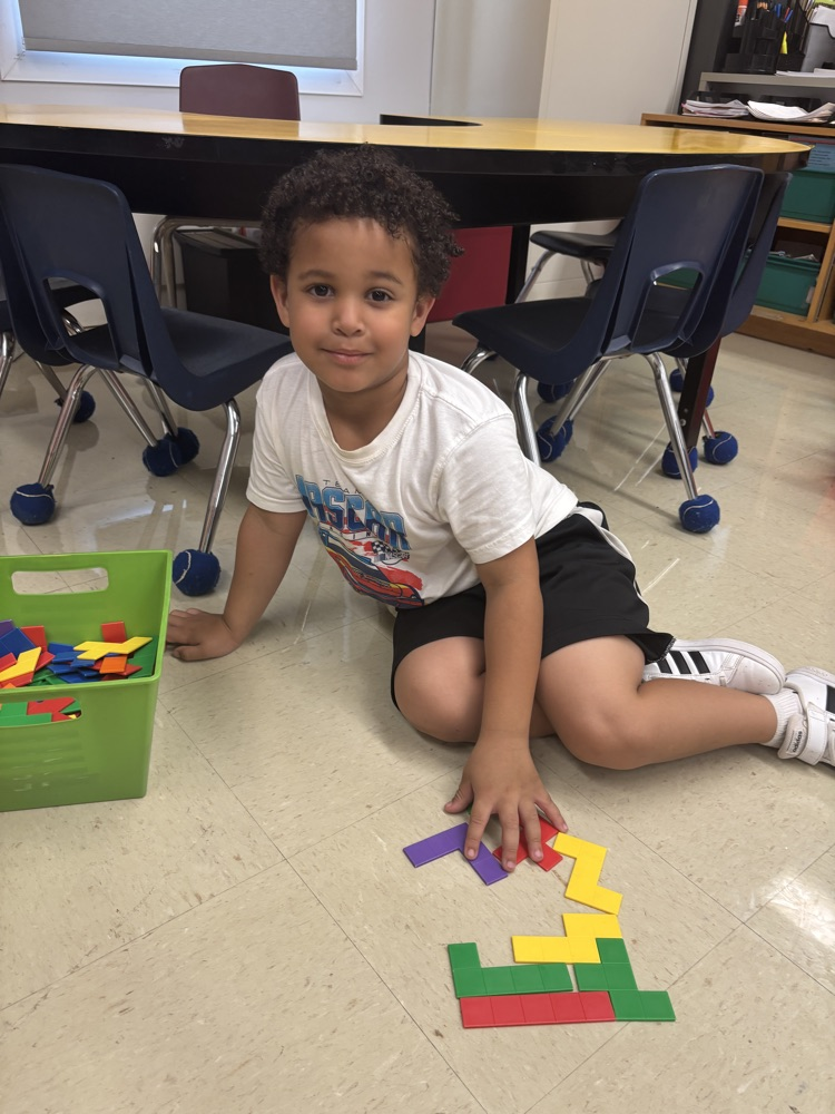student playing on the floor
