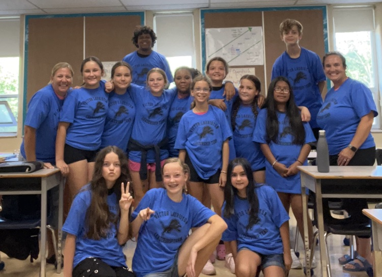 Group of students wearing matching T-shirts as members of the school leadership team