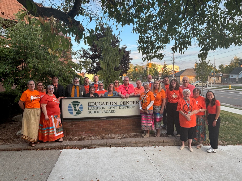 LKDSB Board Trustees + Executive Team pose in their Orange Shirts in honour of Truth + Reconciliation.