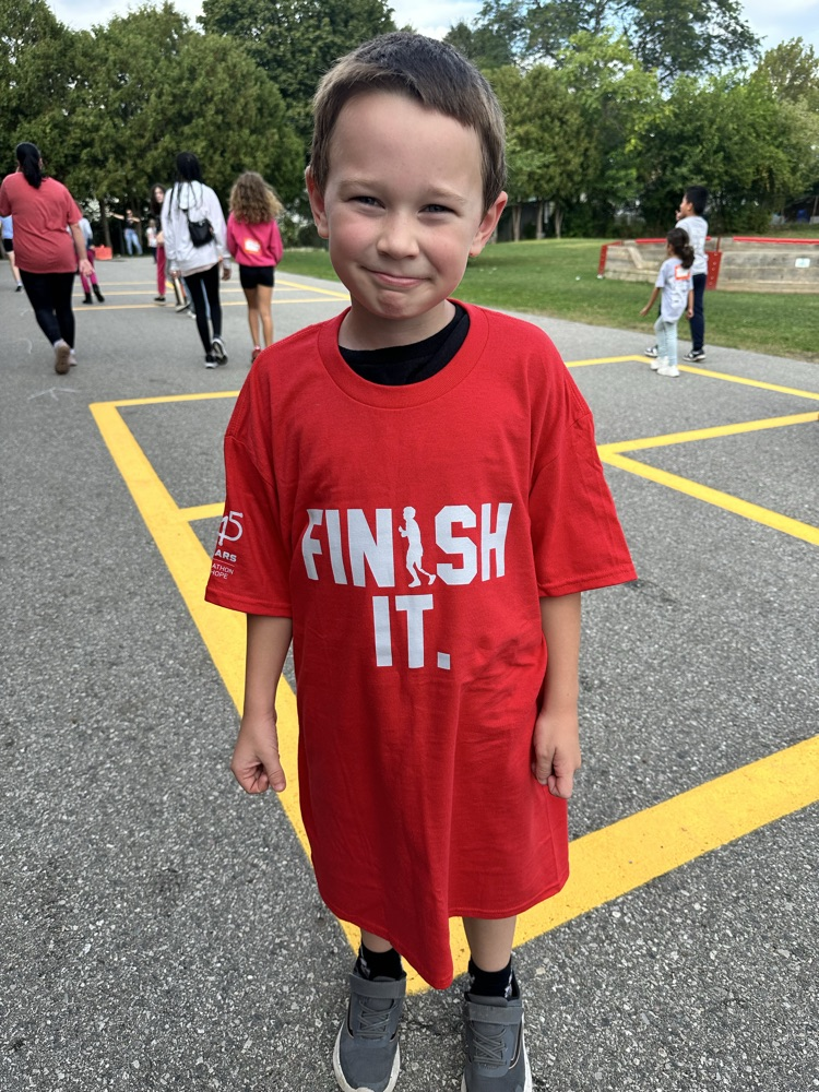 Child wearing finish it shirt for Terry Fox run