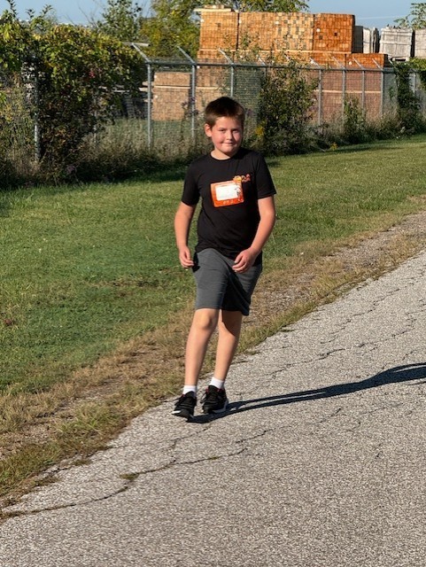 Grade 6 student smiling for the camera for our Terry Fox Run