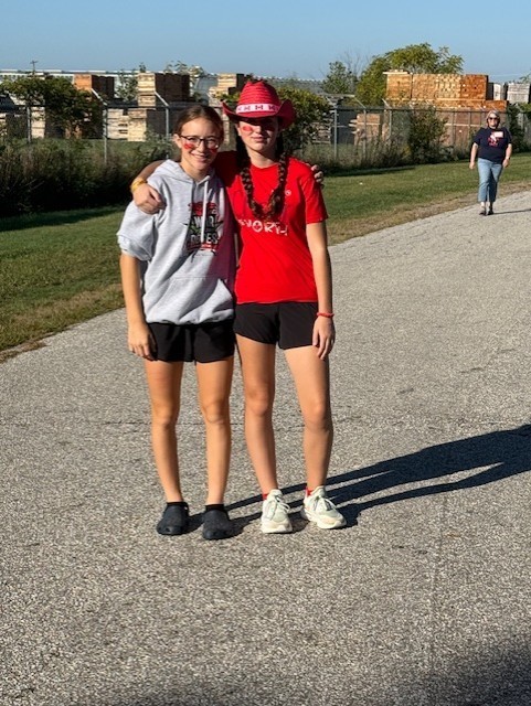 two grade 8 girls standing and smiling for the camera during our Terry Fox Run