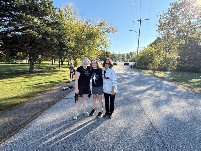 A Grandma with 2 grade 8 girls smile for the camera during our Terry Fox Run today