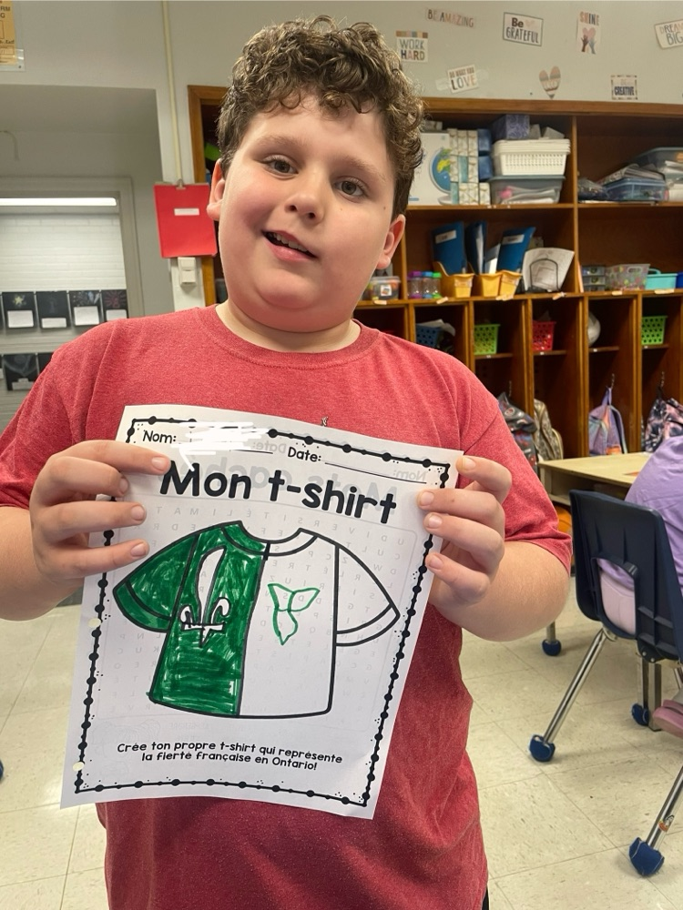 student showing his design