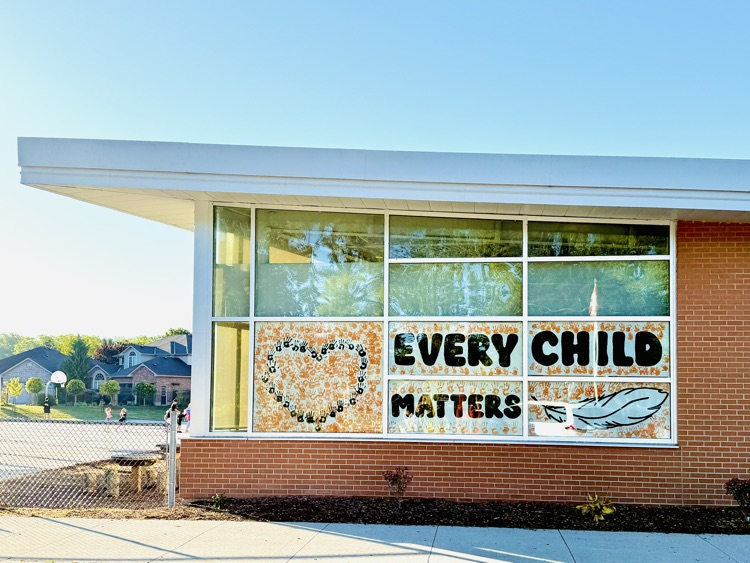school building with Every Child Matters in the windows