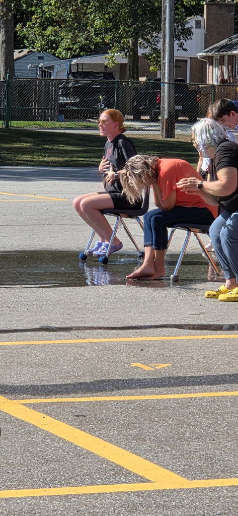teacher sitting on chair 