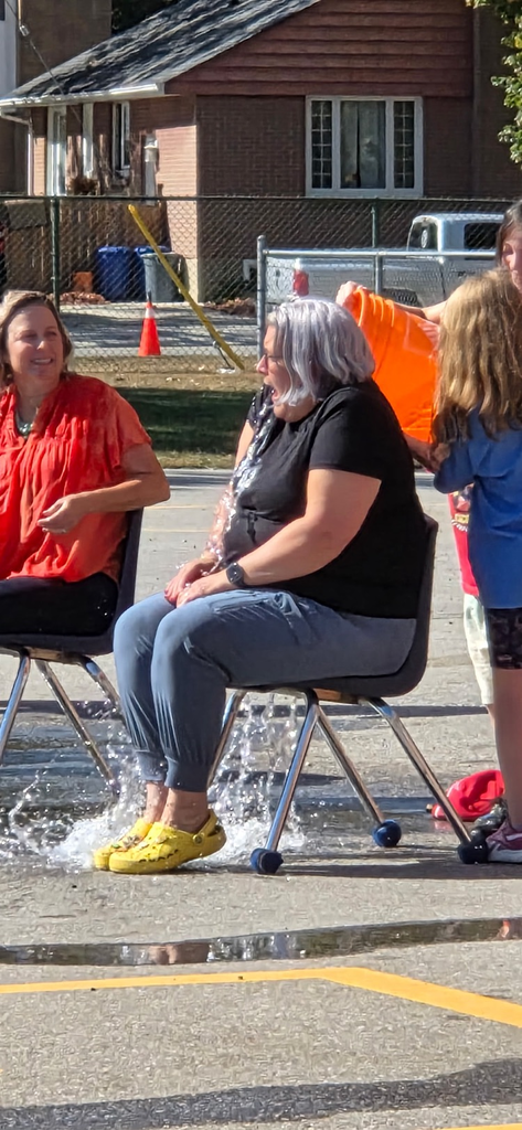 bucket of water being dumped on a teacher by students 