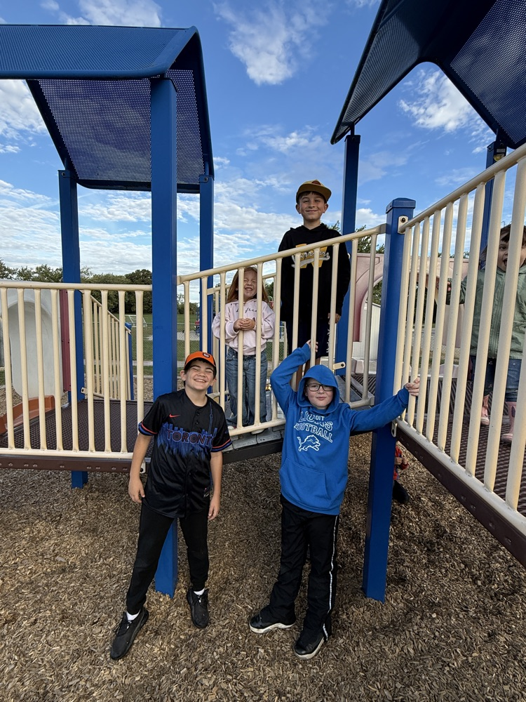 A group of student students playing on the kindergarten playground