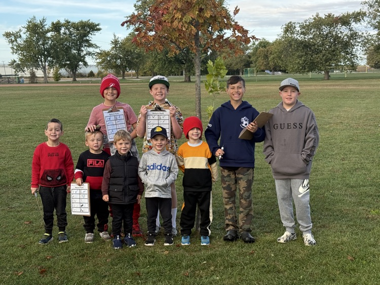 A group of students standing smiling at the camera during their nature hunt
