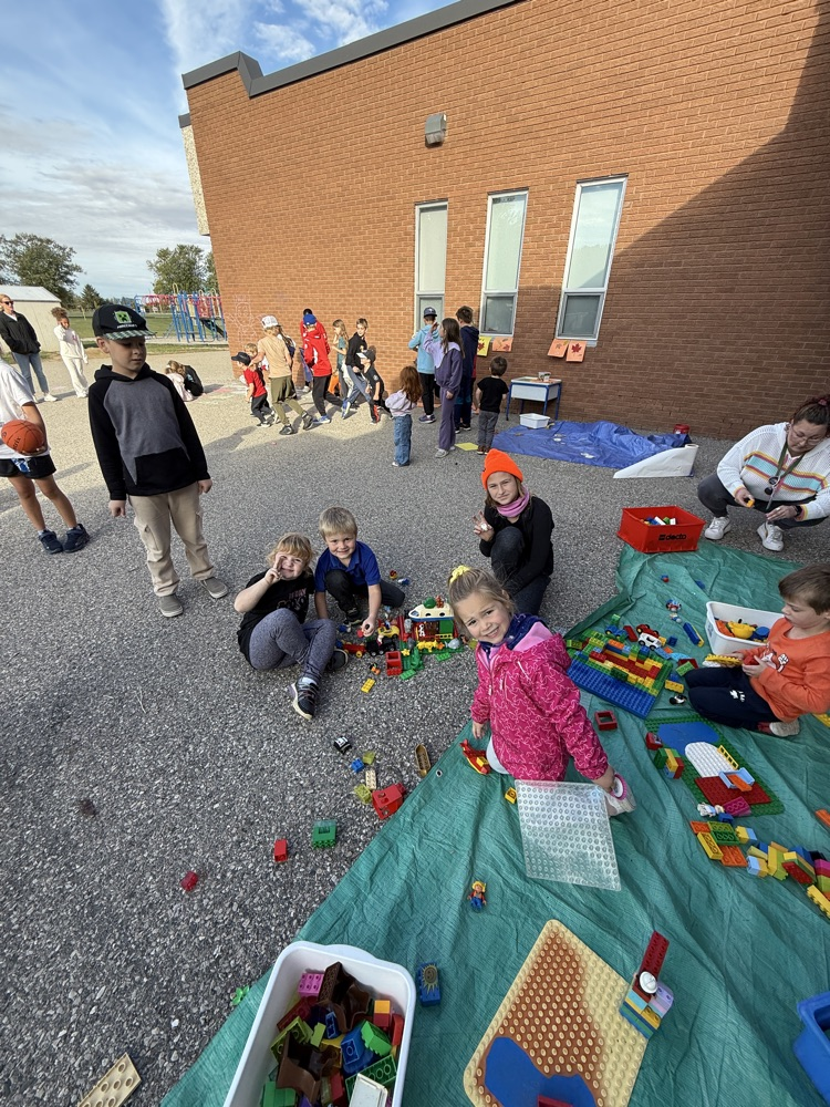A group of students playing with Lego