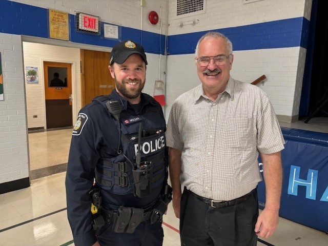 Trustee with community police officer