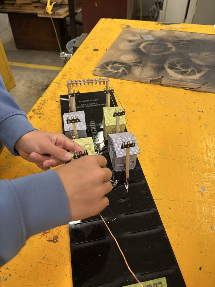 Student wiring a grid 