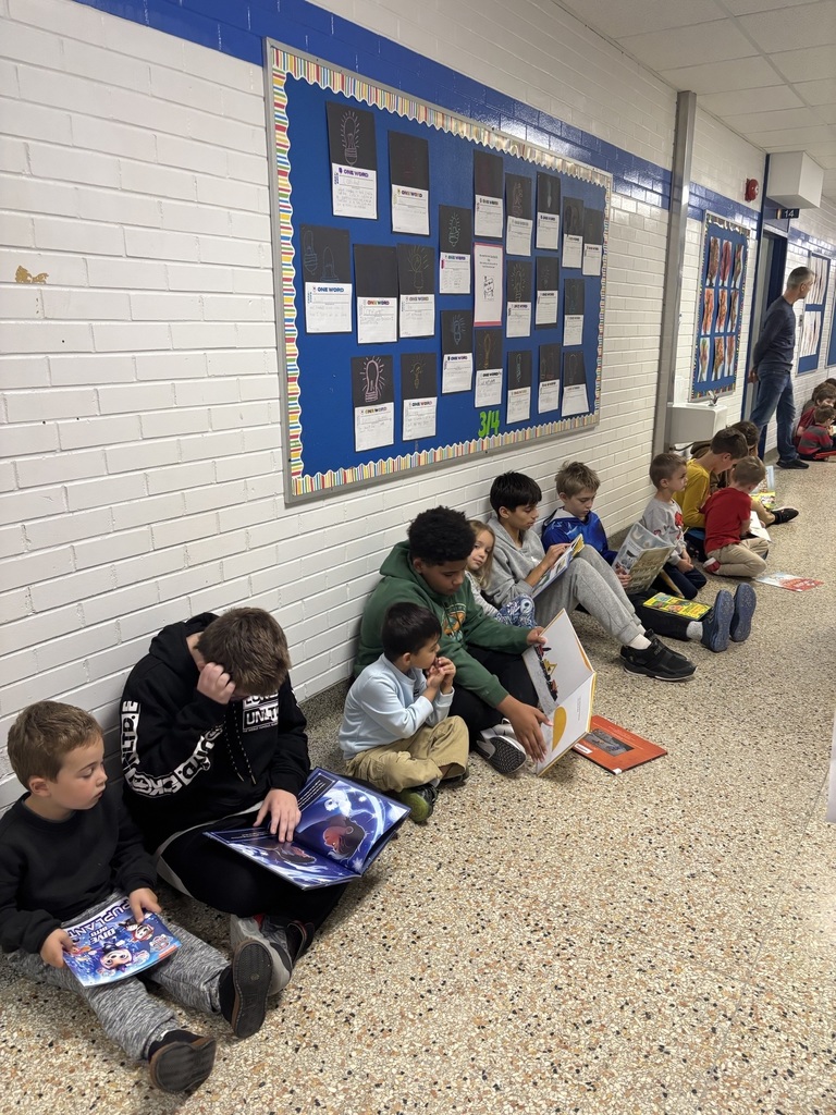Kids sitting in hall reading
