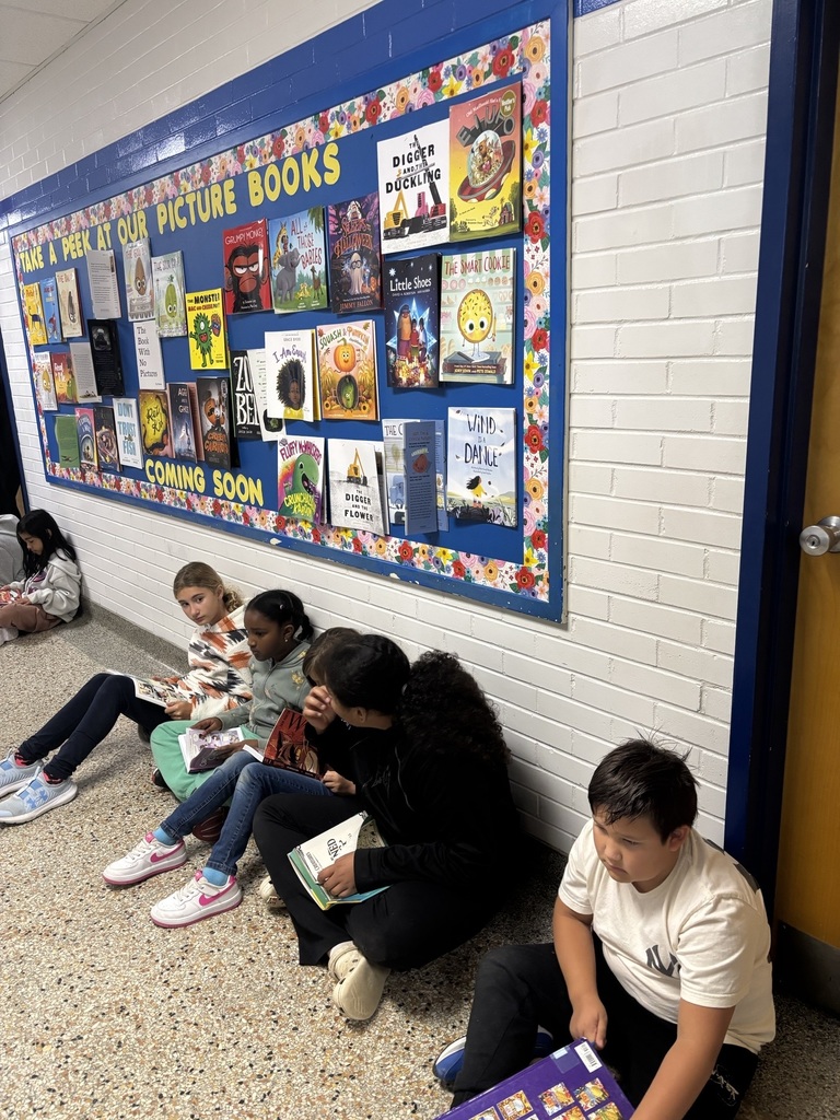 Kids sitting in hall reading