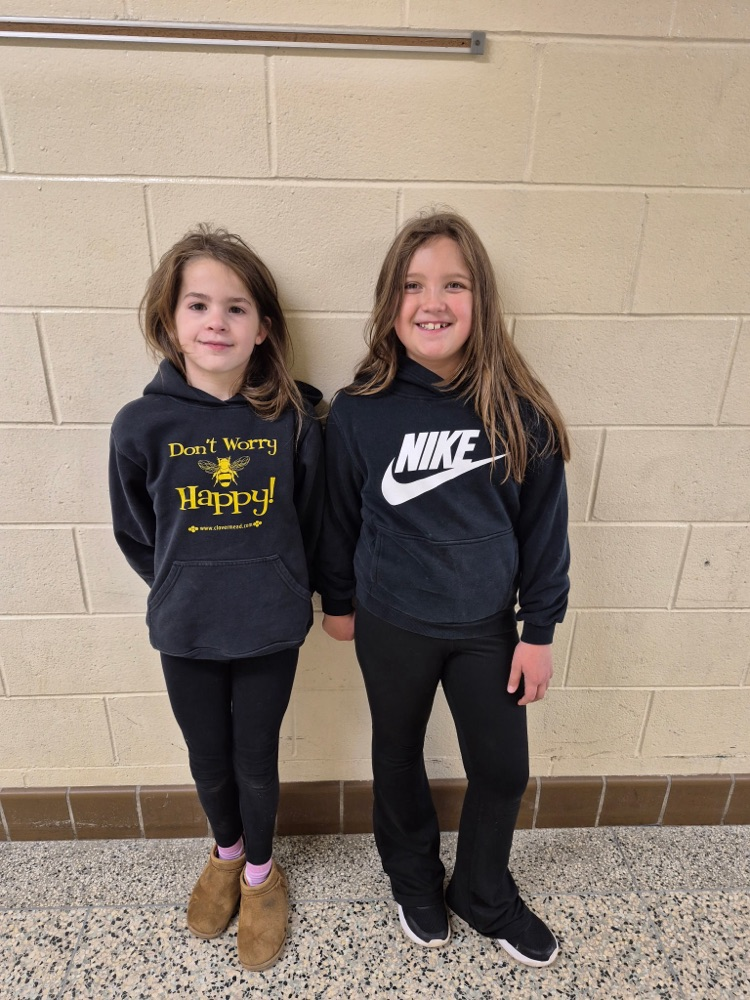 two students wearing black 