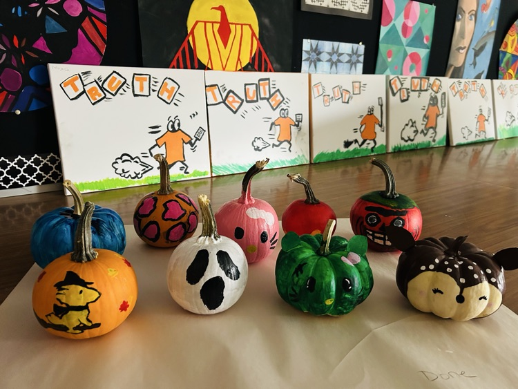 The grade nine visual arts class painted pumpkins for local seniors, sharing their talent to make the porches more festive for Hallowe’en.