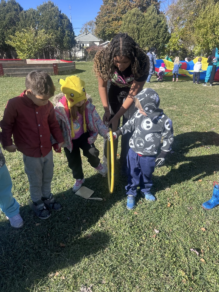 students playing with hula hoops
