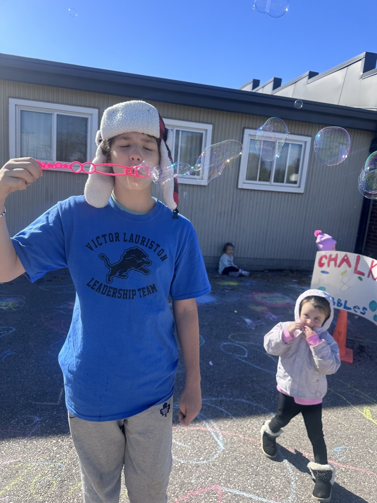 Students blowing bubble