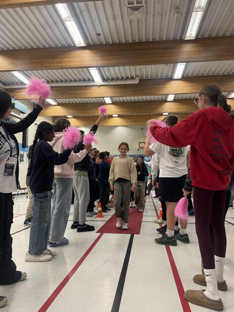 students waking the red carpet