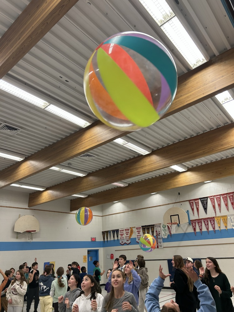 big beach balls bouncing around in the air