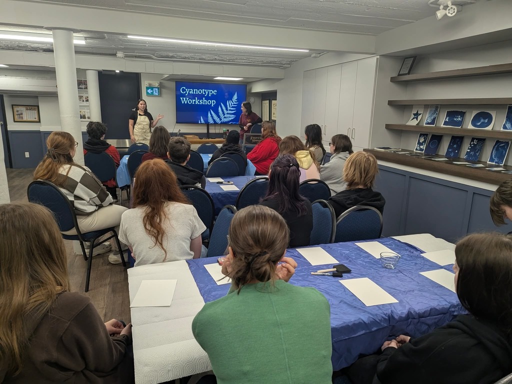 NLSS alumni Jenny Buchanan and Amy Jennings show off the Cyanotape art from the workshop.
