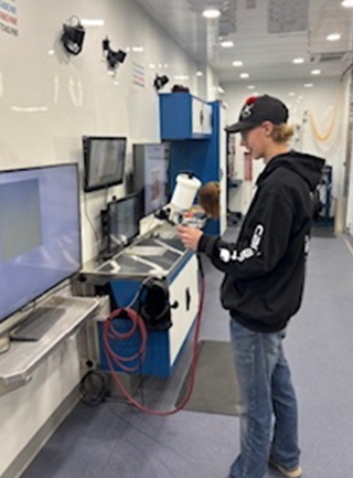 Students trying out the Spray Paint Booth