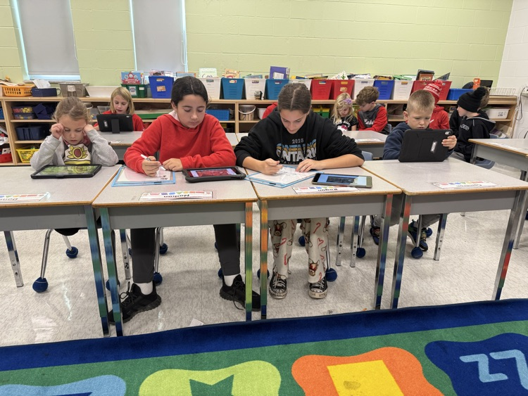 a group of students painting fall art