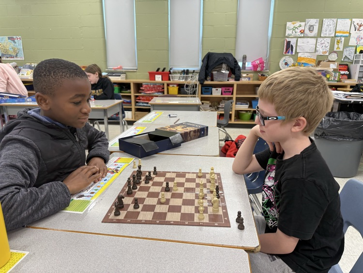 two boys playing chess