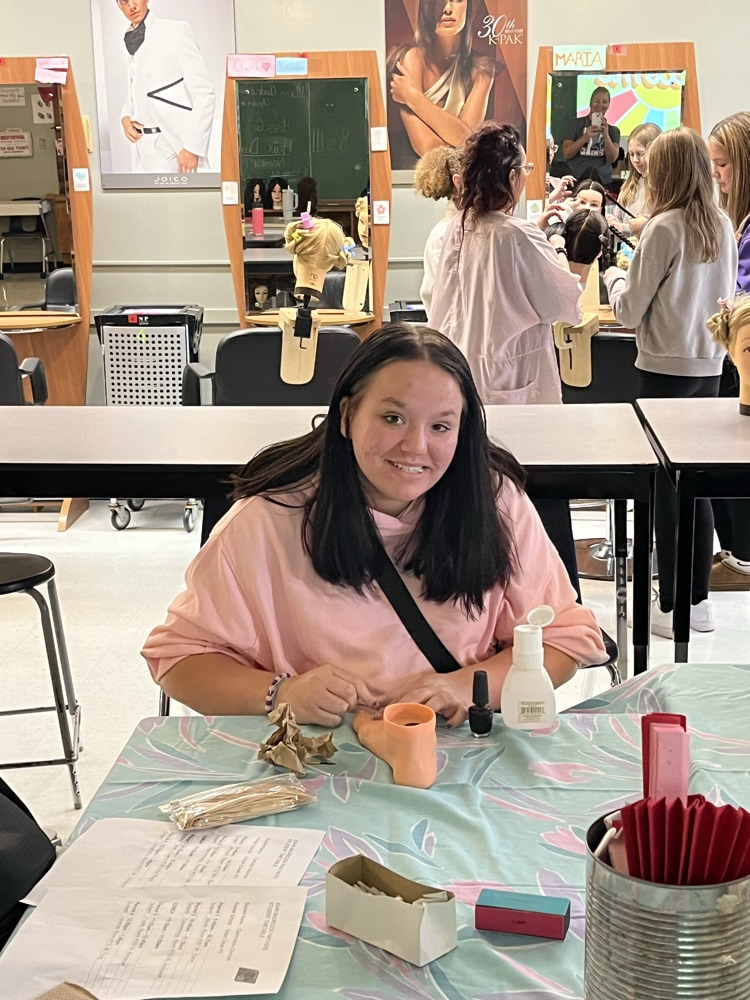 Student practising painting toenails