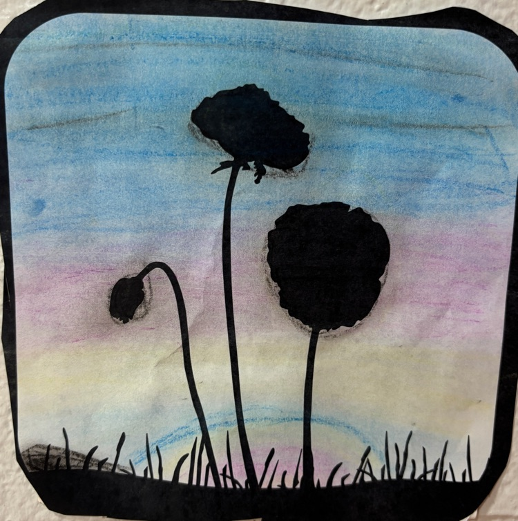 Artwork showing the silhouette of puppies against the sunset