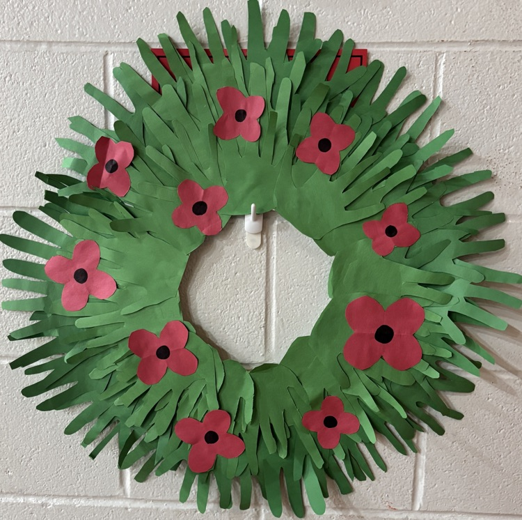 Artwork of a wreath made up of students hand print