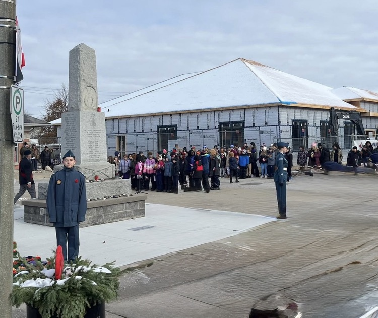 student standing at the Cenotaph