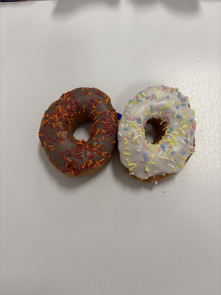 two donuts one chocolate, one vanilla
