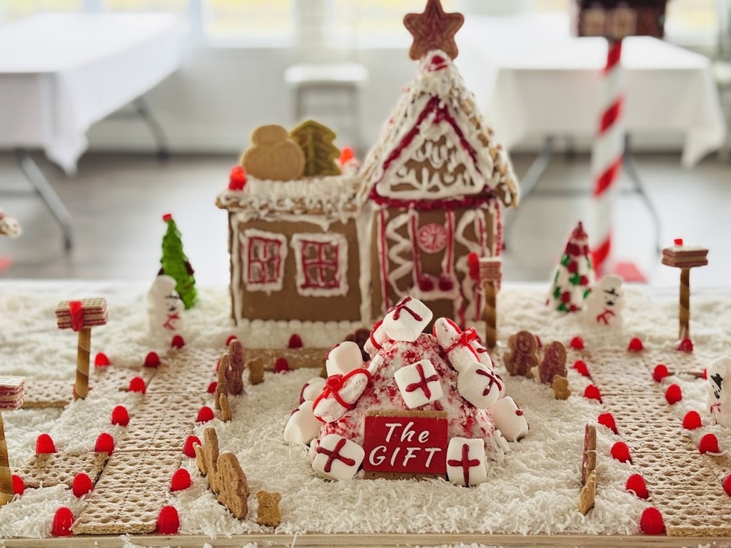 Gingerbread house decorated in red and white