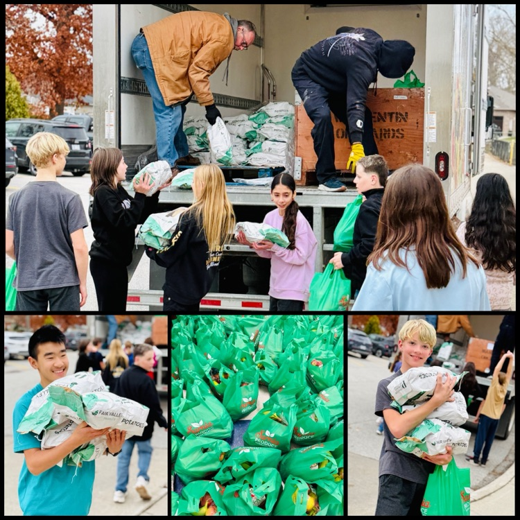 students unloading food from a truck