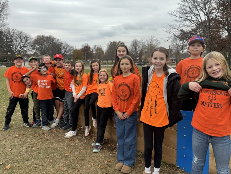 group wearing orange shirts