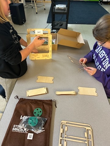 students building mini greenhouses 