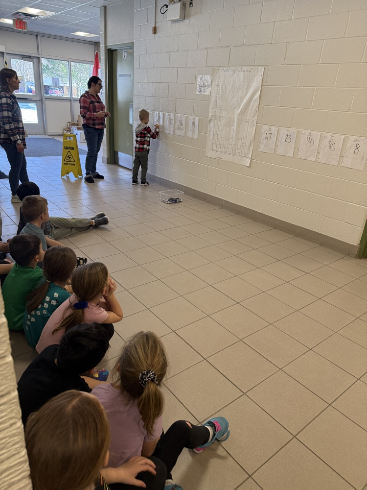 students in SK/1 counting and learning math with our canned food drive