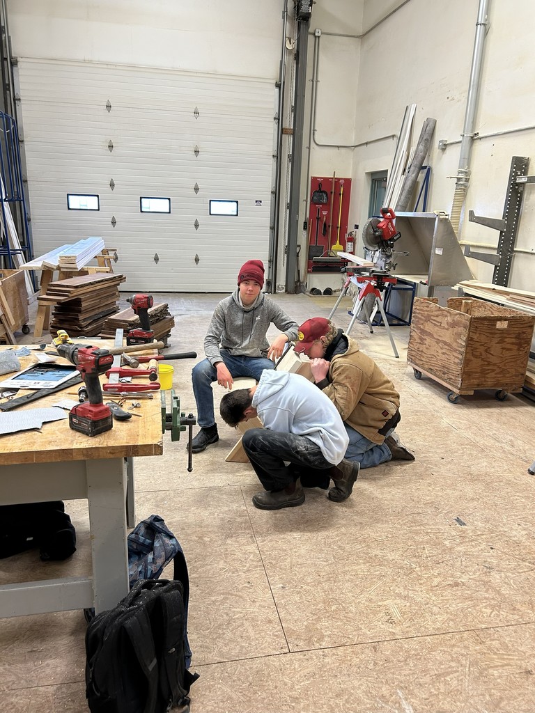 Students constructing a bench.