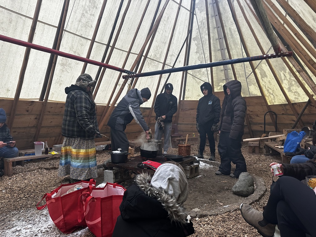 Attending the food over the fire