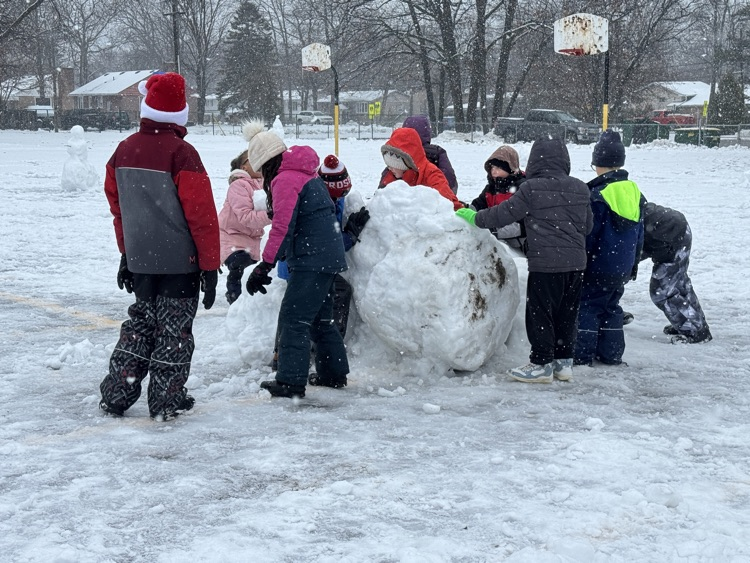 students playing in the snow 